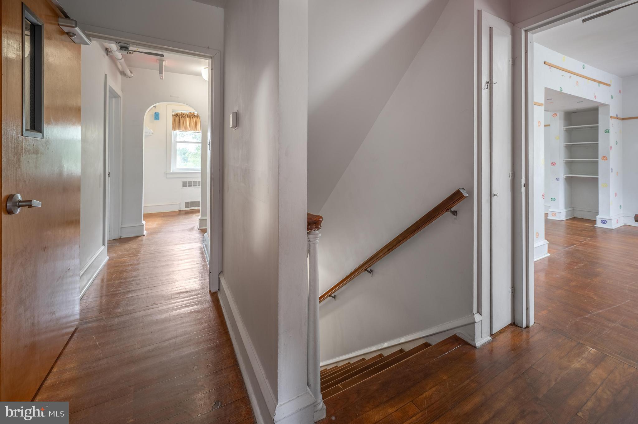 189 Watsontown Road Berlin, NJ 08009 - Photo 23 of 35 a view of a hallway with wooden floor and staircase
