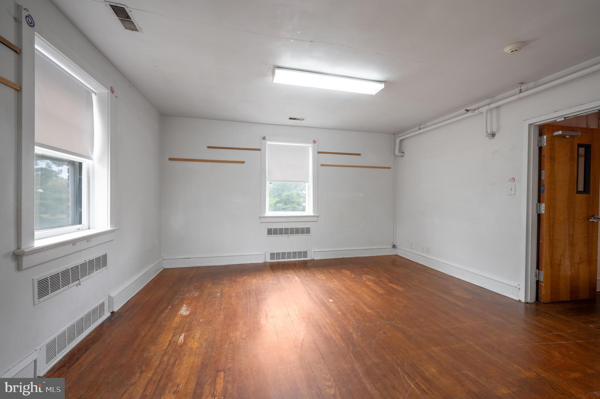 189 Watsontown Road Berlin, NJ 08009 - Photo 26 of 35 an empty room with wooden floor and windows