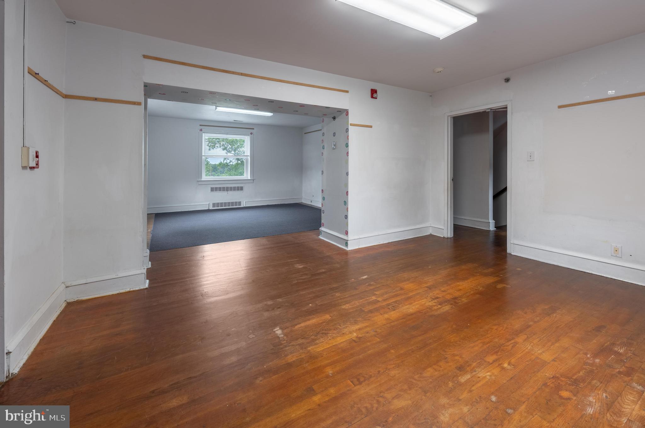 189 Watsontown Road Berlin, NJ 08009 - Photo 29 of 35 a view of an empty room with wooden floor and a window