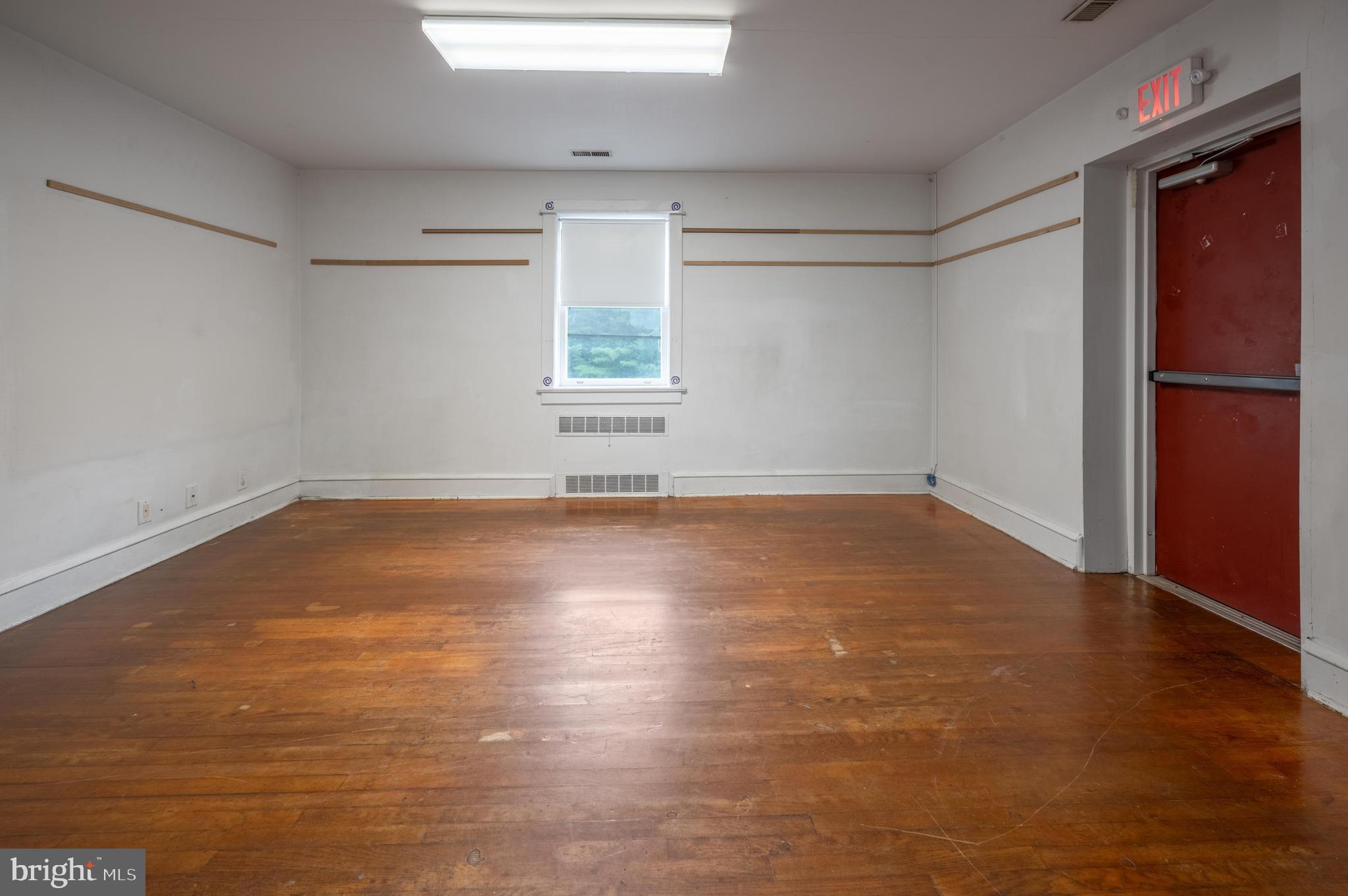189 Watsontown Road Berlin, NJ 08009 - Photo 30 of 35 an empty room with wooden floor and windows