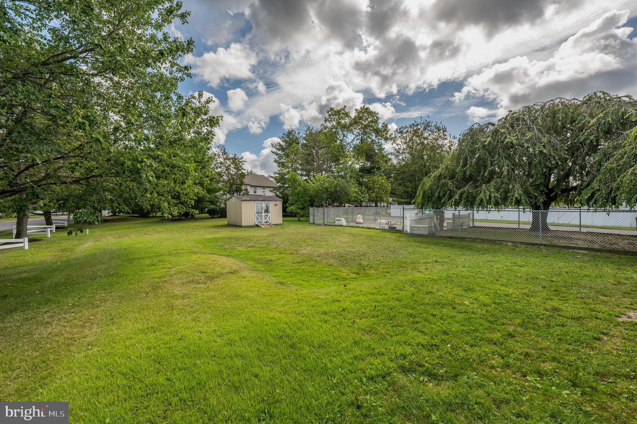 189 Watsontown Road Berlin, NJ 08009 - Photo 6 of 35 a view of green field with trees in the background