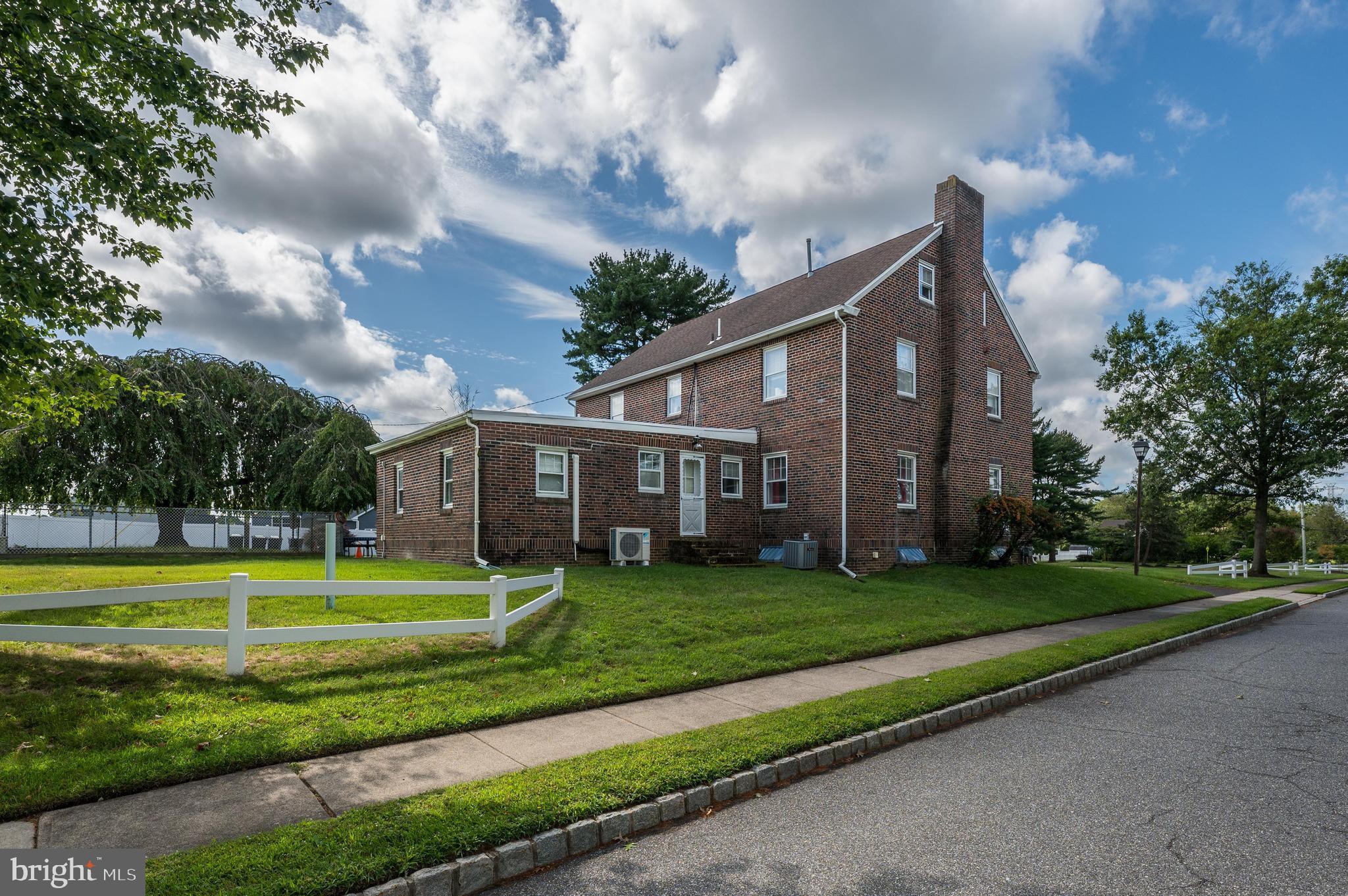 189 Watsontown Road Berlin, NJ 08009 - Photo 7 of 35 a view of a big house in a big yard with large trees