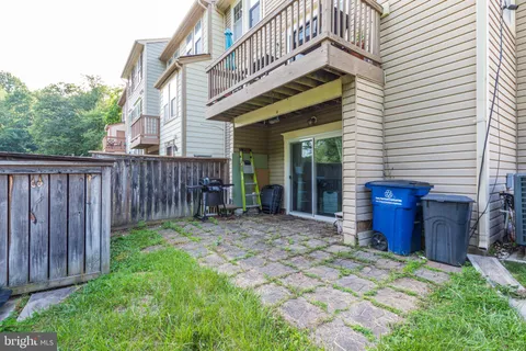 a view of a house with wooden fence