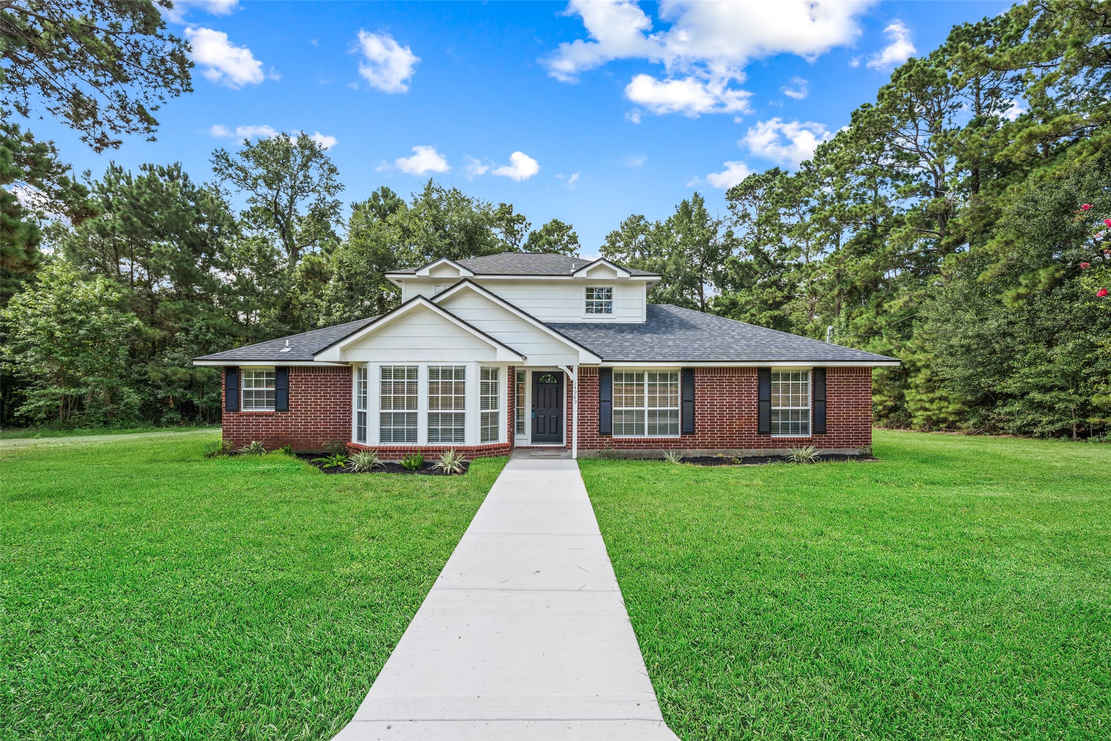 14989 Old Humble Pipeline Road Conroe, TX 77302 - Photo 33 of 33 Welcome home! *grass has been superimposed*