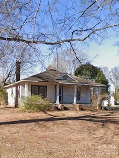 a front view of a house with yard