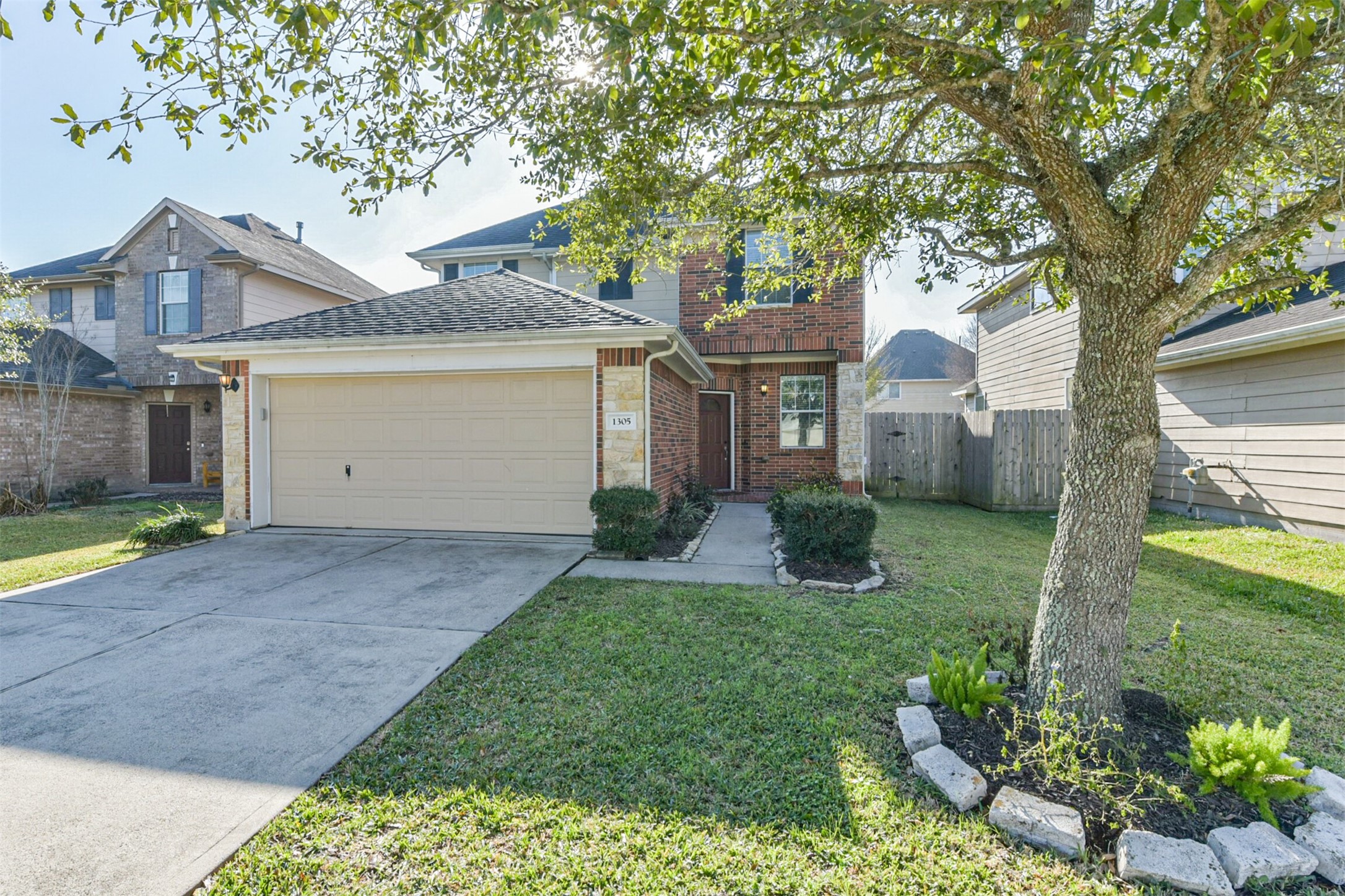a view of a house with yard and a garden