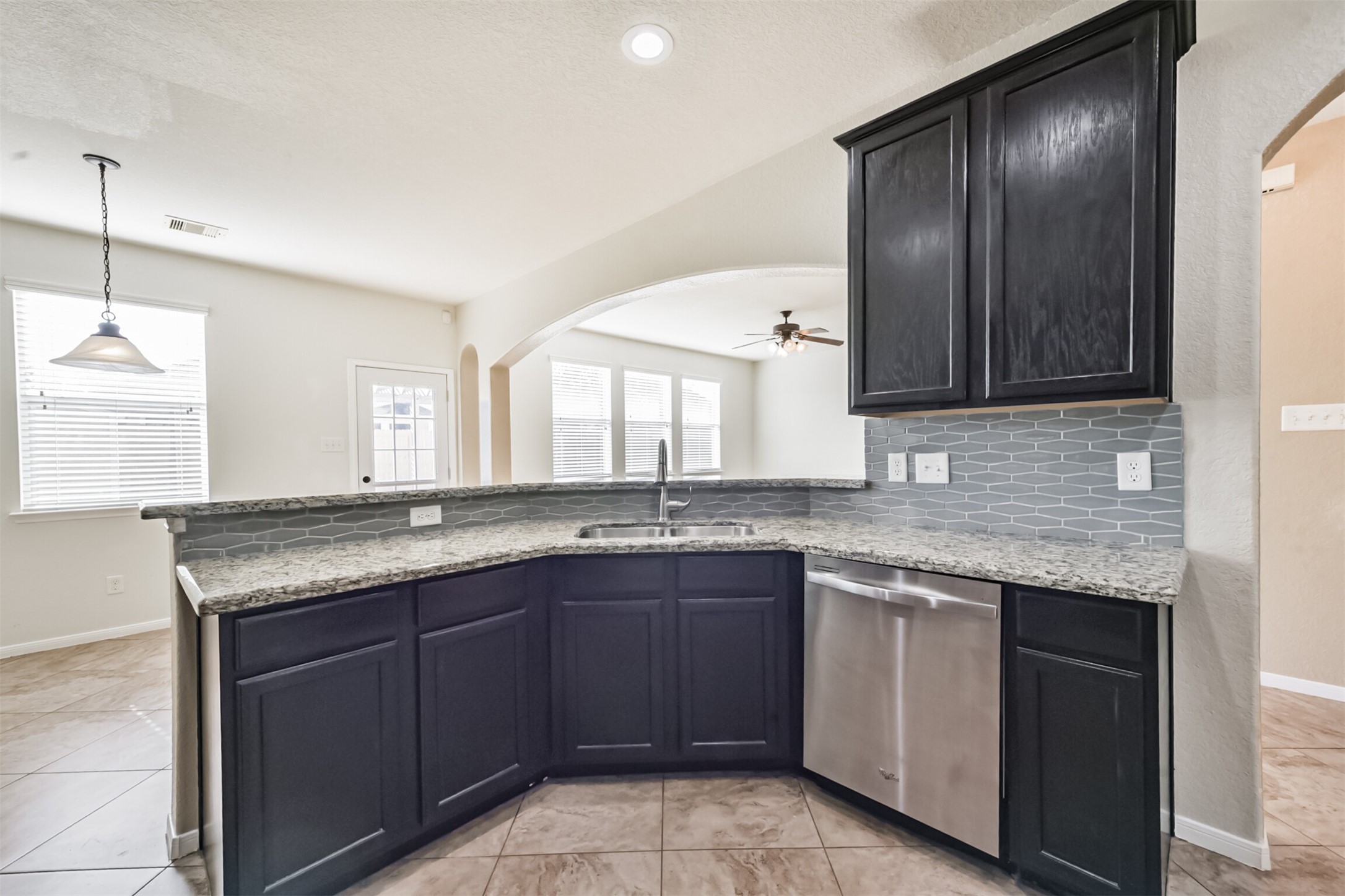 1305 Pinto Pass Alvin, TX 77511 - Photo 14 of 40 a kitchen with a sink and cabinets
