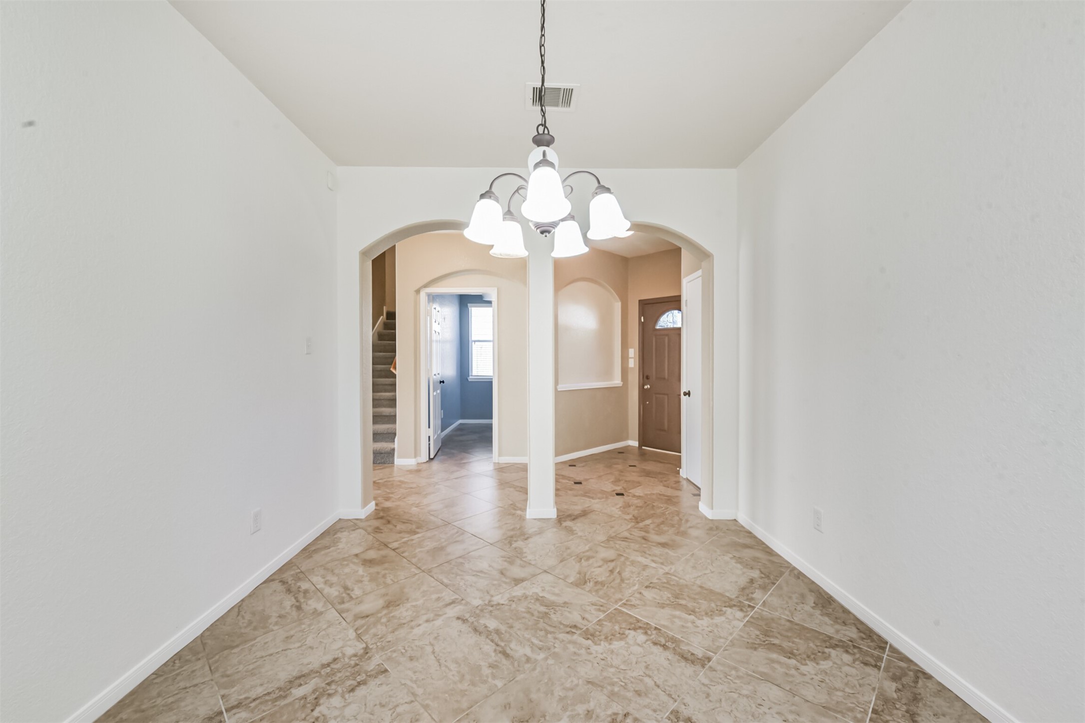 1305 Pinto Pass Alvin, TX 77511 - Photo 18 of 40 a view of a chandelier in a room