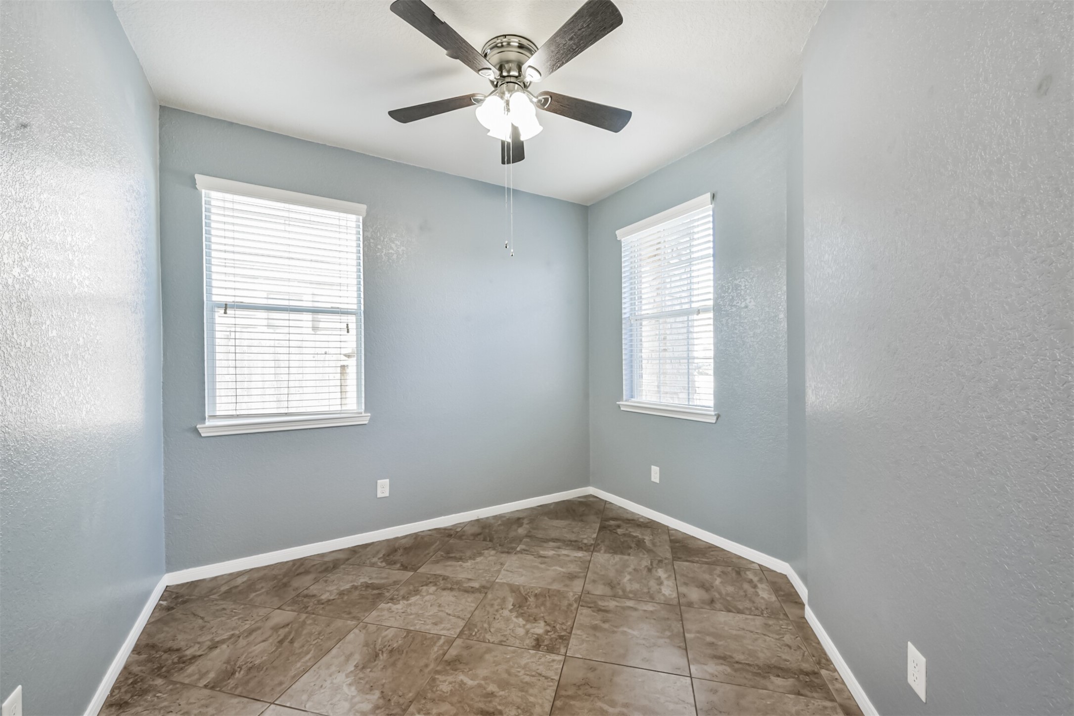 1305 Pinto Pass Alvin, TX 77511 - Photo 19 of 40 a view of a big room with windows