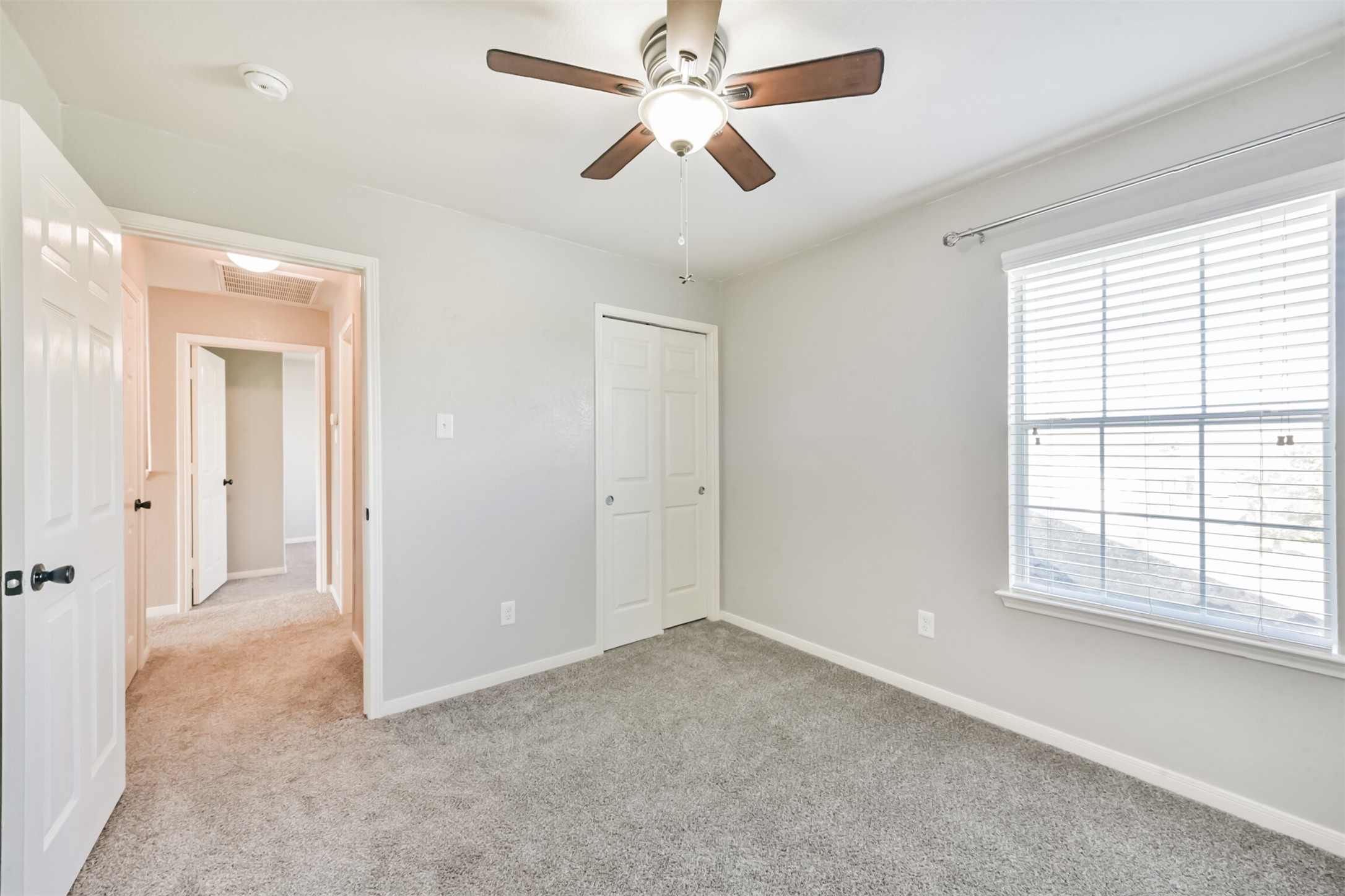 1305 Pinto Pass Alvin, TX 77511 - Photo 33 of 40 a view of a livingroom with a ceiling fan and window