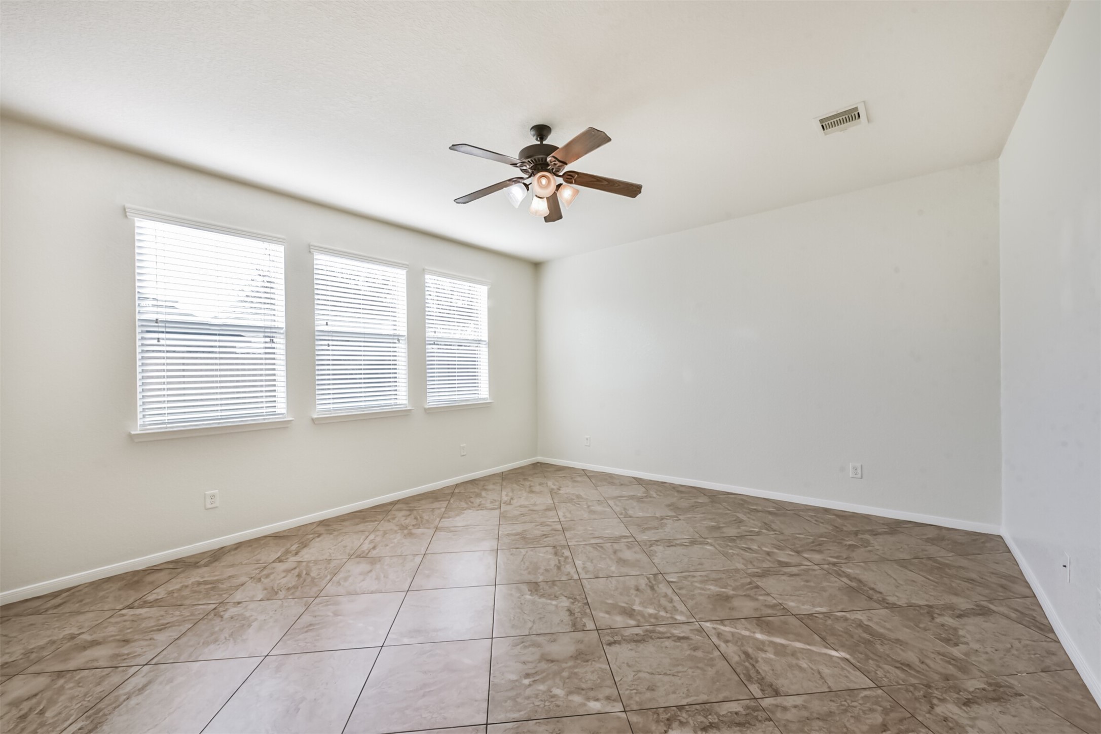 1305 Pinto Pass Alvin, TX 77511 - Photo 7 of 40 wooden floor in an empty room with a window