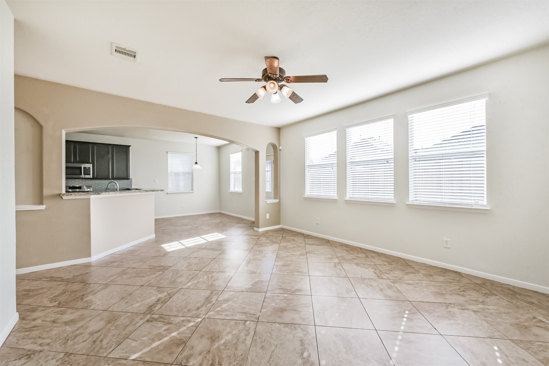 1305 Pinto Pass Alvin, TX 77511 - Photo 9 of 40 a view of an empty room with a kitchen