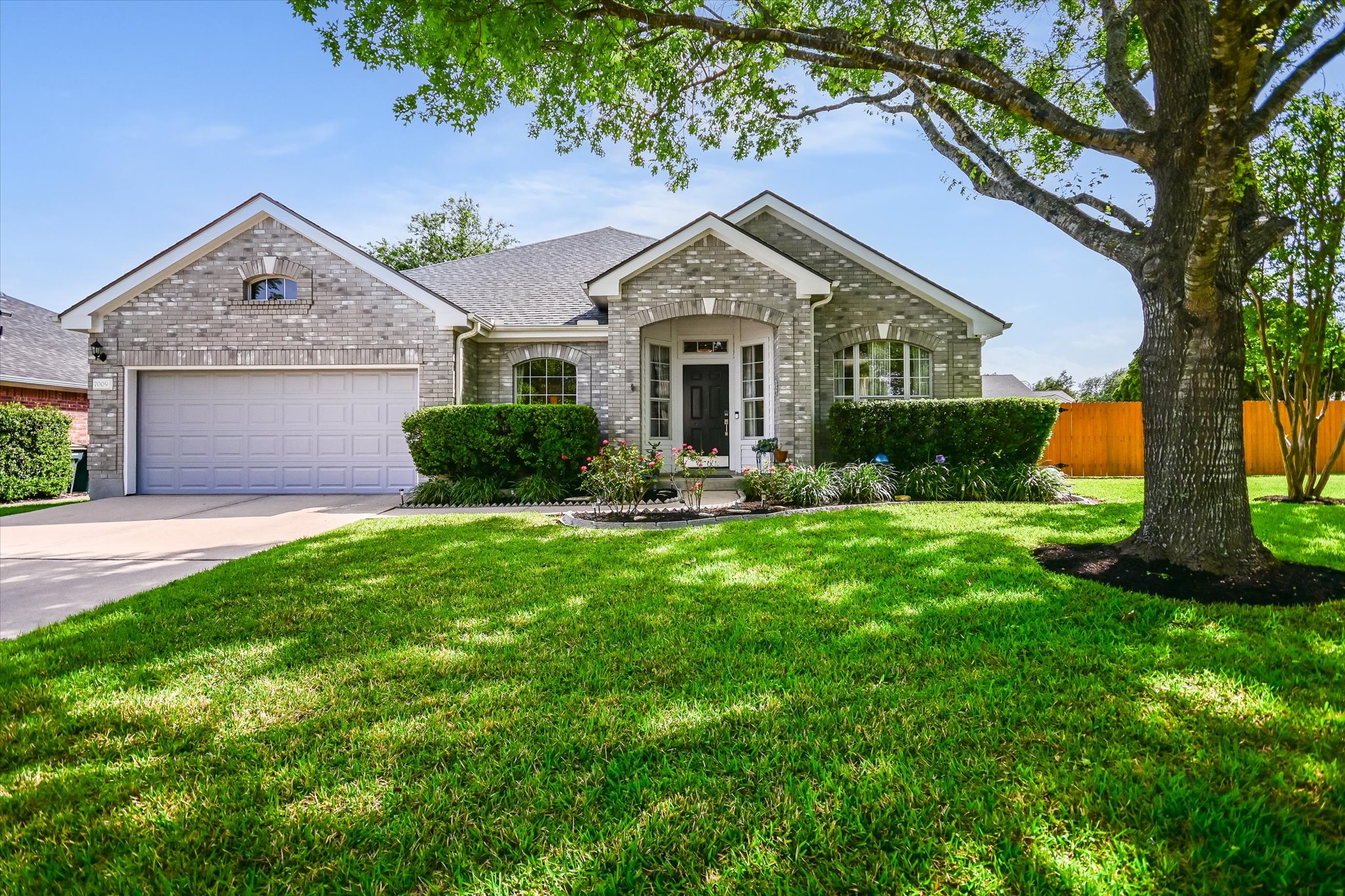 7009 Rambollet Terrace Round Rock, TX 78681 - Photo 1 of 1 a front view of a house with a yard and garage