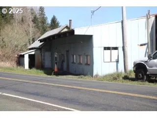a black car parked in front of a house