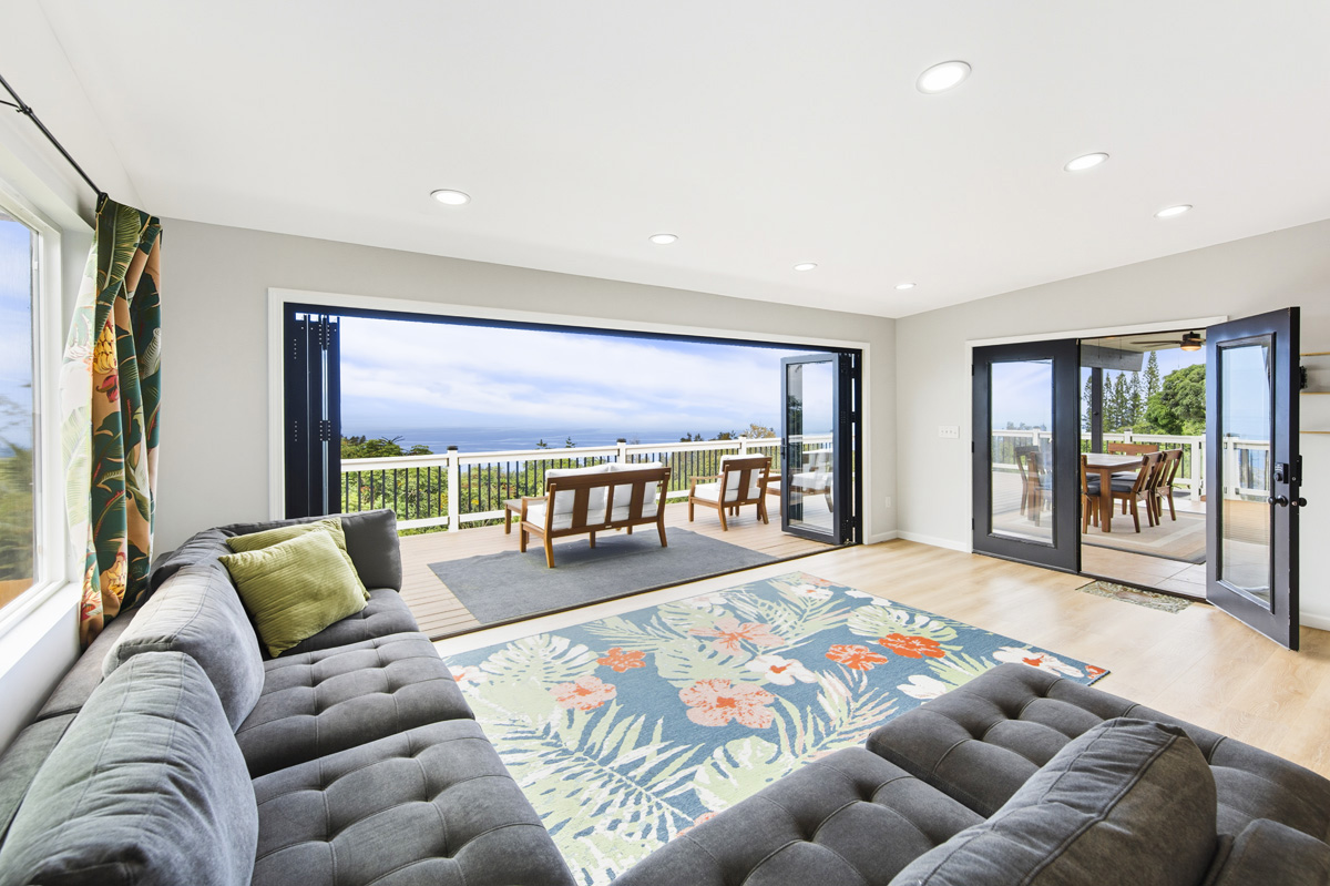 87-2451 Hawaiʻi Belt Road Captain Cook, HI 96704 - Photo 1 of 30 a living room with furniture and a large window