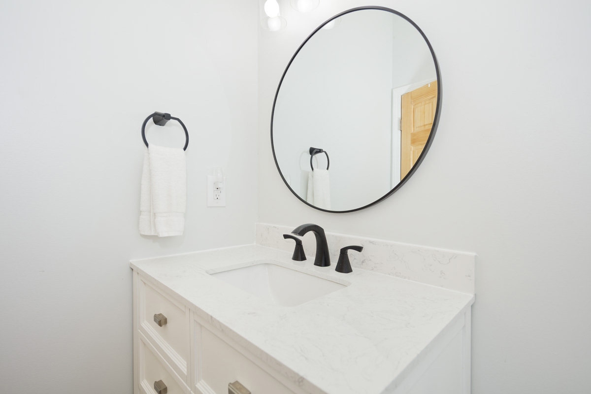 87-2451 Hawaiʻi Belt Road Captain Cook, HI 96704 - Photo 14 of 30 a bathroom with a sink and a mirror