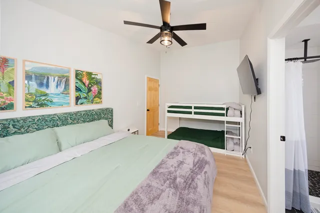 a bedroom with a bed and a fireplace