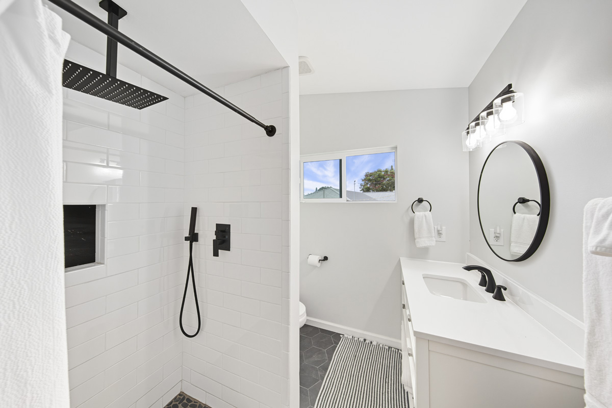 87-2451 Hawaiʻi Belt Road Captain Cook, HI 96704 - Photo 17 of 30 a bathroom with a sink and a mirror