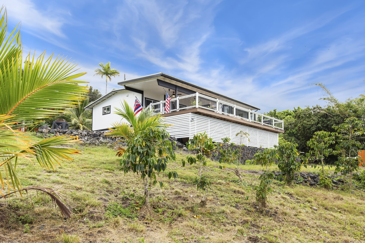 87-2451 Hawaiʻi Belt Road Captain Cook, HI 96704 - Photo 21 of 30 a front view of a house with a yard