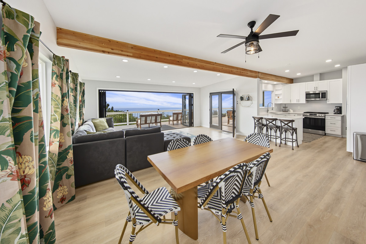 87-2451 Hawaiʻi Belt Road Captain Cook, HI 96704 - Photo 24 of 30 a view of a dining room with furniture and a chandelier
