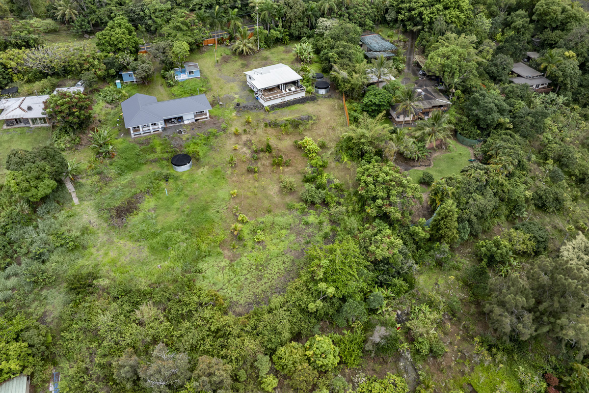 87-2451 Hawaiʻi Belt Road Captain Cook, HI 96704 - Photo 26 of 30 an aerial view of residential house with outdoor space and trees all around