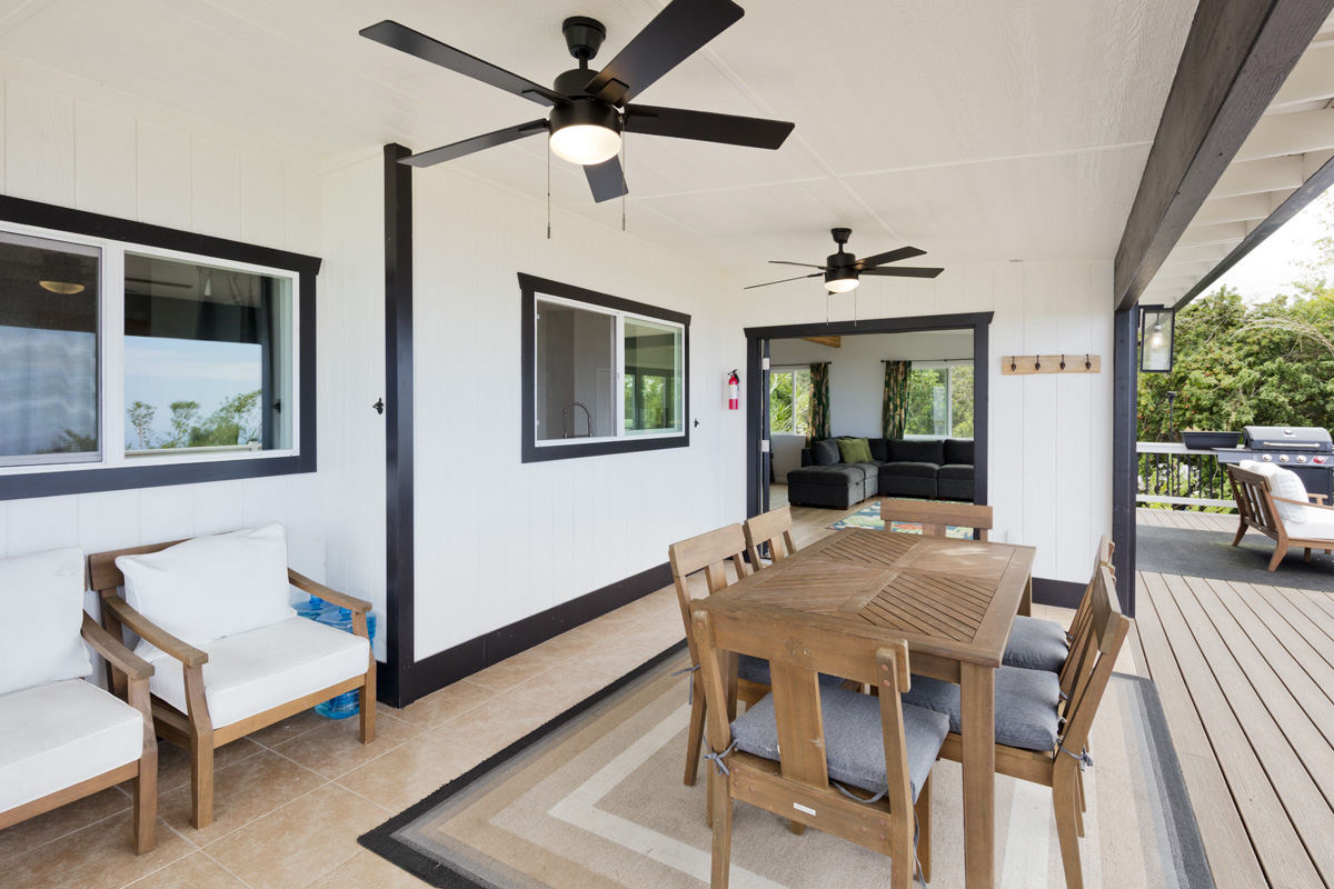 87-2451 Hawaiʻi Belt Road Captain Cook, HI 96704 - Photo 3 of 30 a view of a dining room with furniture window and wooden floor
