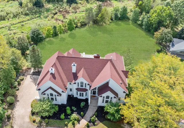 a living room with fireplace furniture and a flat screen tv