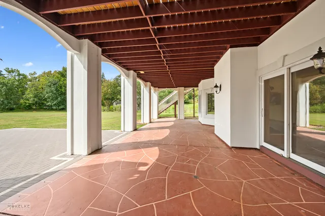 a kitchen with stainless steel appliances a refrigerator and wooden cabinets