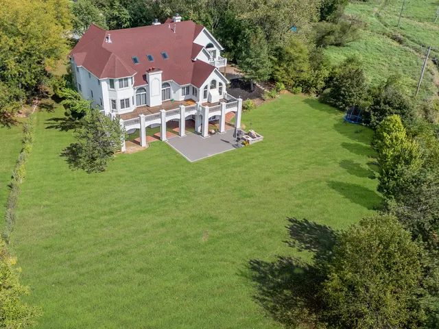 a kitchen with stainless steel appliances granite countertop a stove sink microwave and cabinets