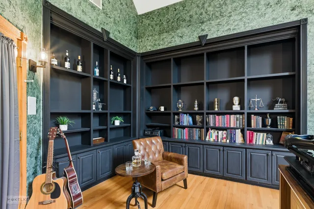 a bedroom with a bed and a couch