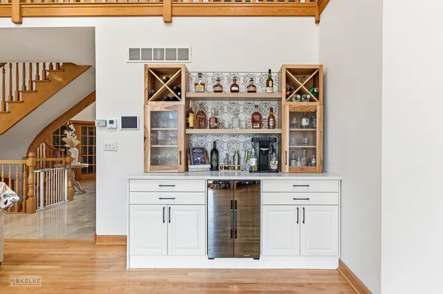 a bedroom with a bed lamps and fireplace