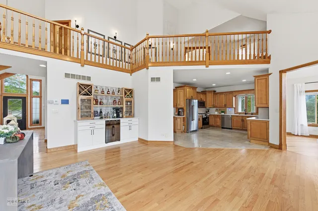 a view of a livingroom with a fireplace and a chandelier