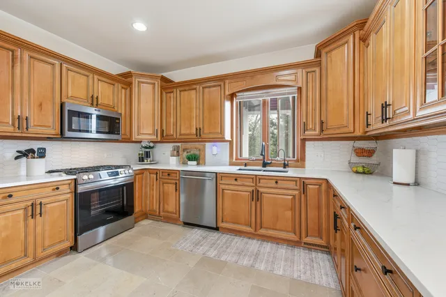 a large bathroom with a glass door shower and a sink