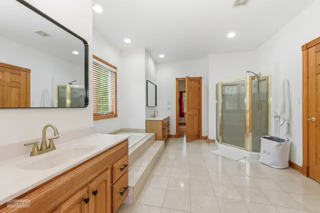 a view of an empty room with a fireplace and a window