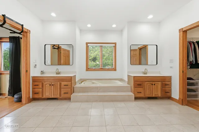 a living room with a fireplace and a large window