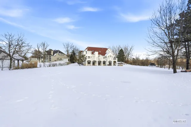 a view of a backyard of the house