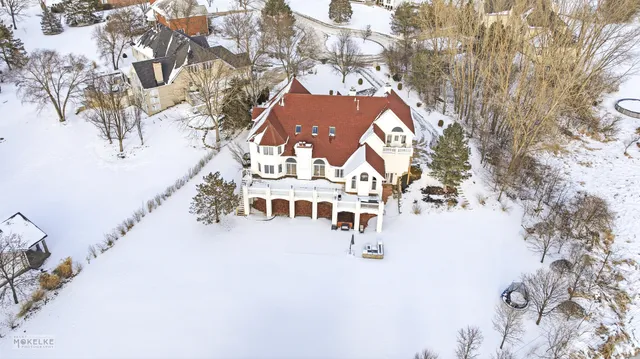 an aerial view of a house with a garden and yard