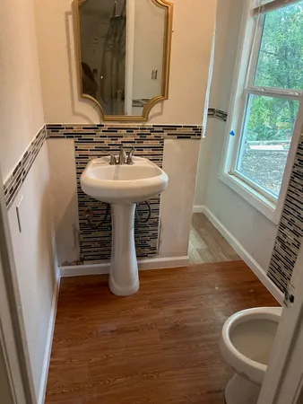 a bathroom with a sink and a mirror