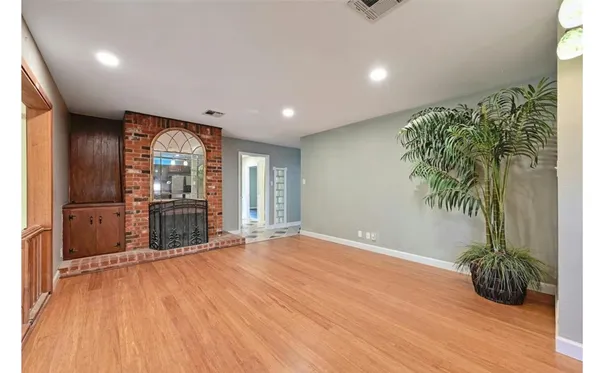 a view of an entryway with wooden floor