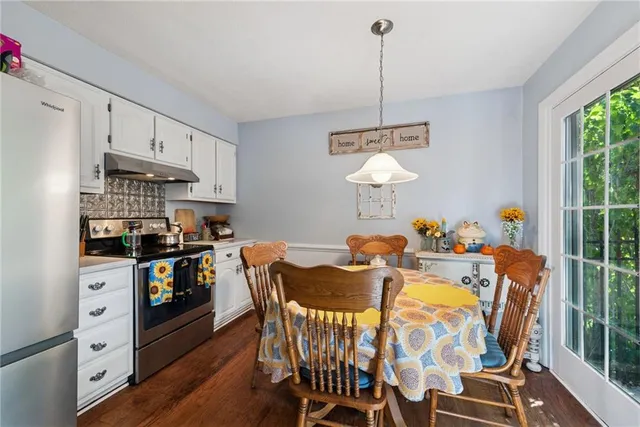 a view of a dining room with furniture window and outside view