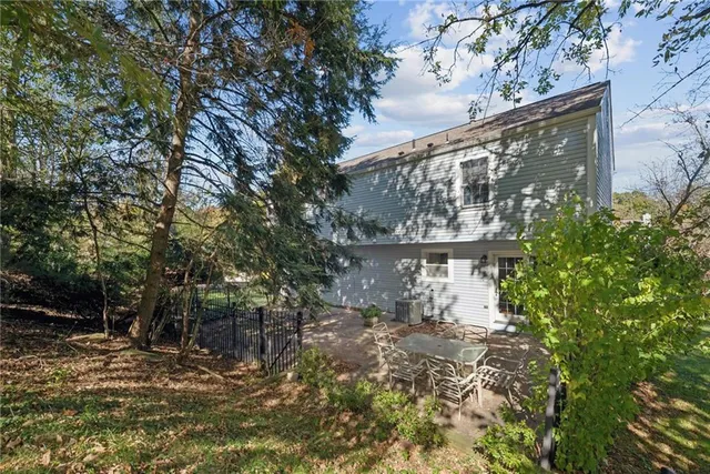 a backyard of a house with lots of green space