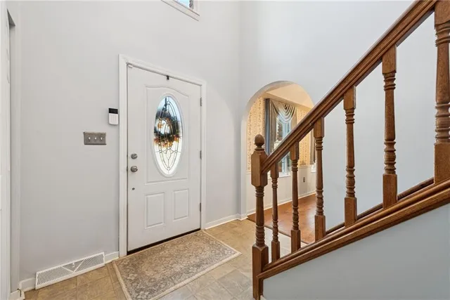 a view of an entryway with wooden floor