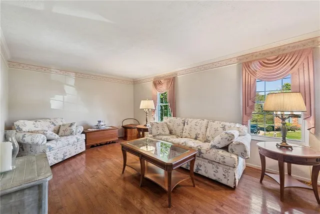 a living room with furniture and a lamp