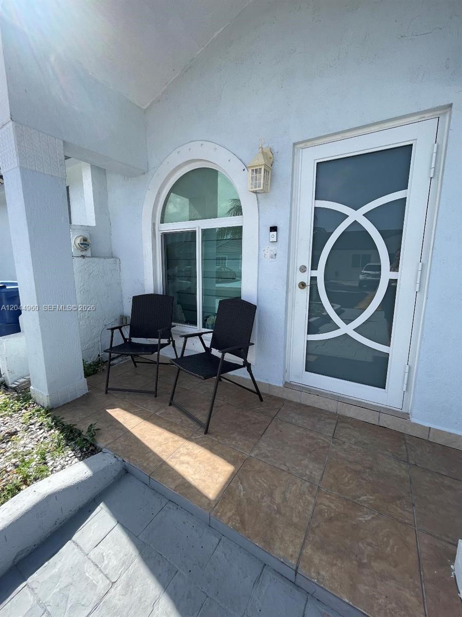 7681 Northwest 178th Terrace Hialeah, FL 33015 - Photo 2 of 11 a living room with furniture and a fireplace