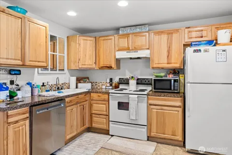 an aerial view of multiple houses with yard