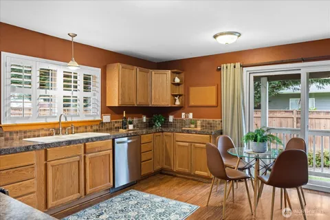 a kitchen with a sink and cabinets