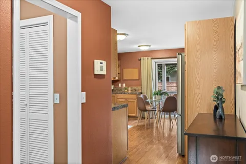 a view of a livingroom with furniture and hardwood floor