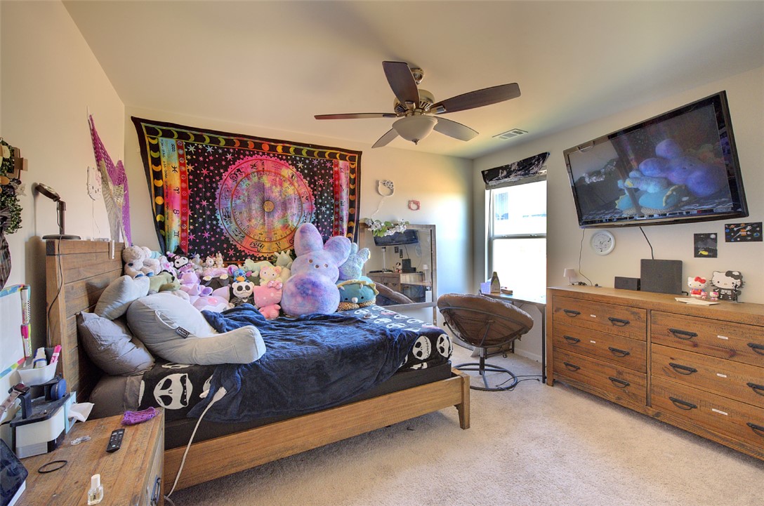 408 Chadwick Lane Walhalla, SC 29691 - Photo 22 of 44 A comfortable bedroom features plush carpet flooring and a ceiling fan for optimal airflow.