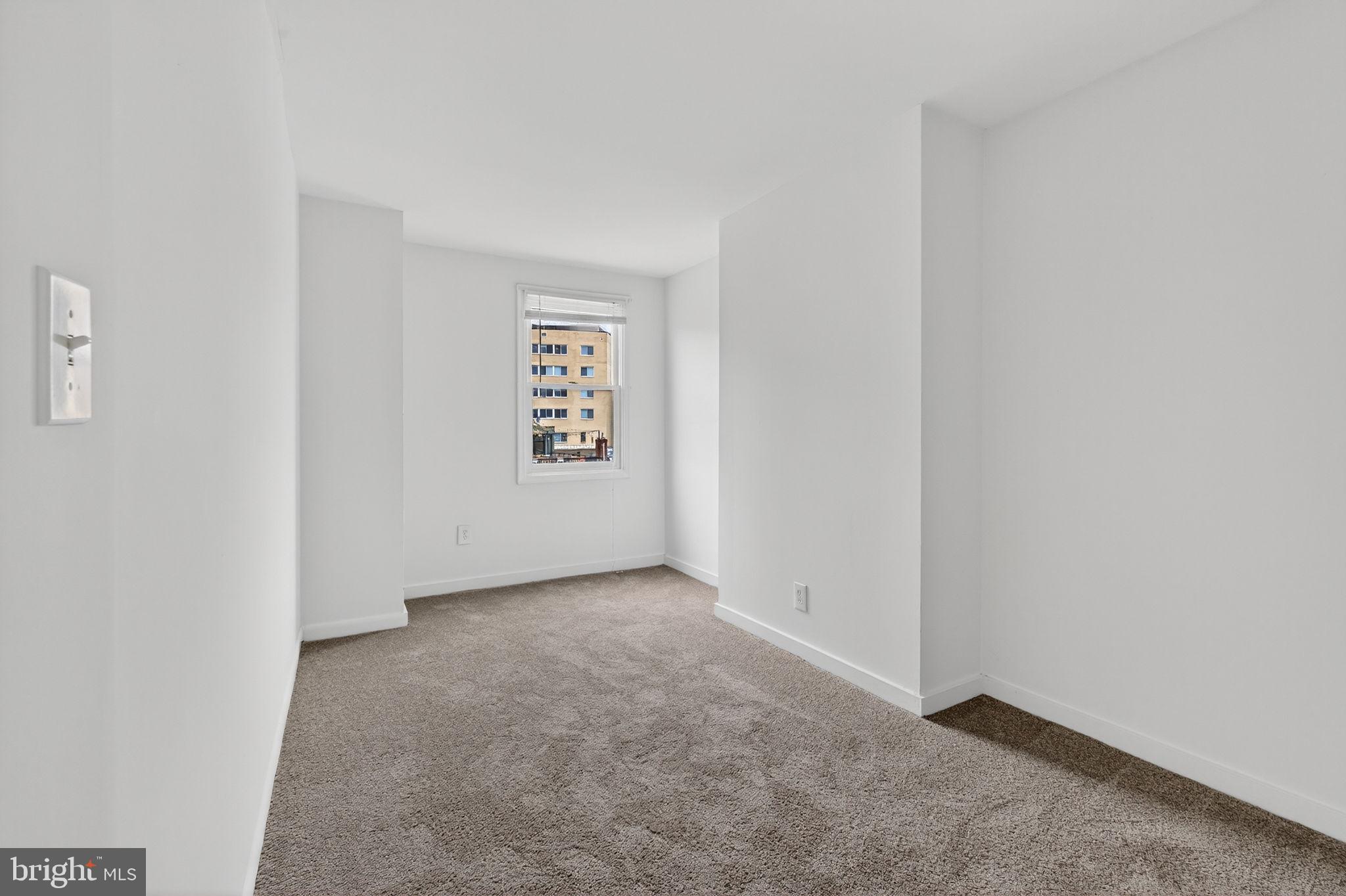 2441 18th Street Northwest, Unit 5 Washington, DC 20009 - Photo 18 of 23 a view of an empty room and a window
