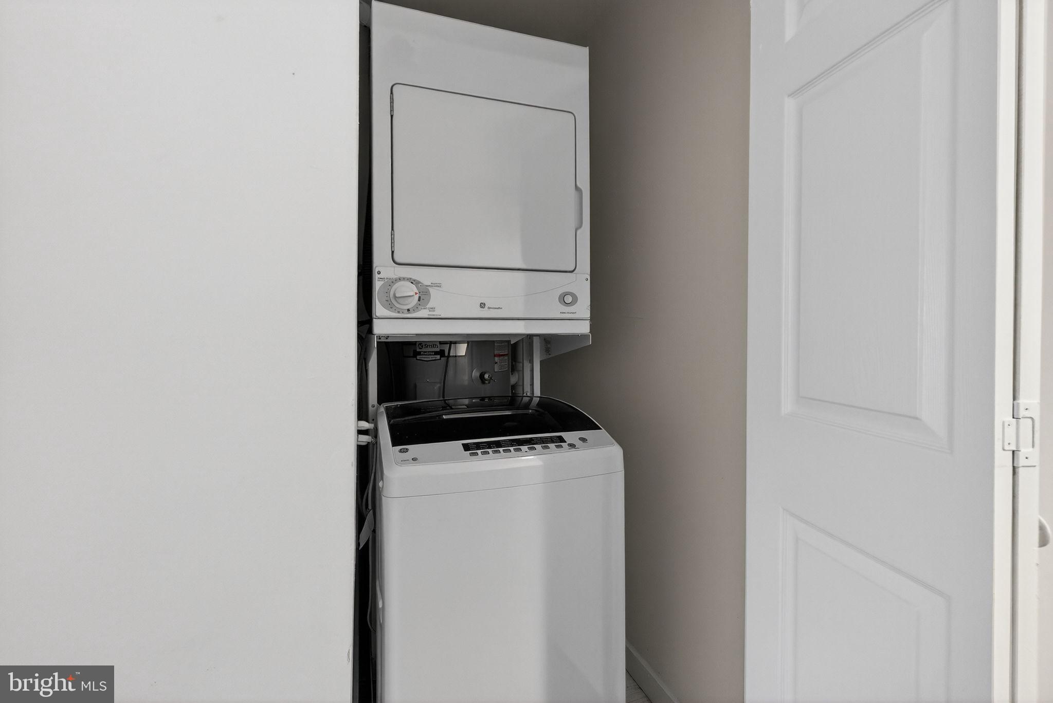 2441 18th Street Northwest, Unit 5 Washington, DC 20009 - Photo 21 of 23 a utility room with dryer and washer